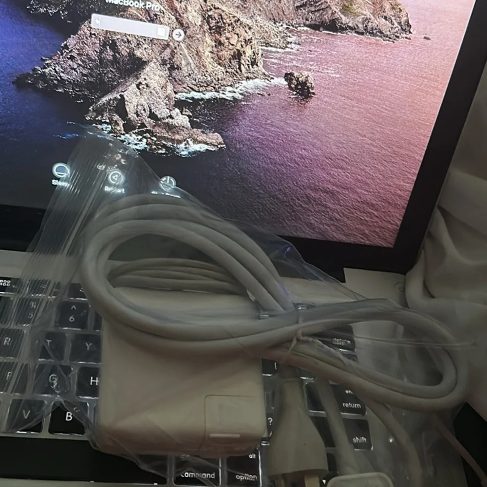 This is a MacBook Pro that comes with a charger and it’s 15 inches NC ONLY